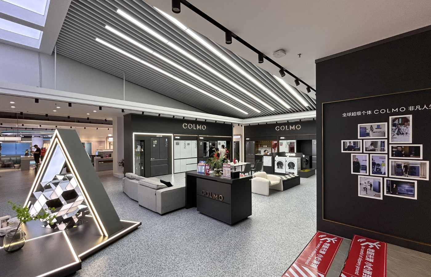 COLMO appliance product display wall with premium retail fixtures