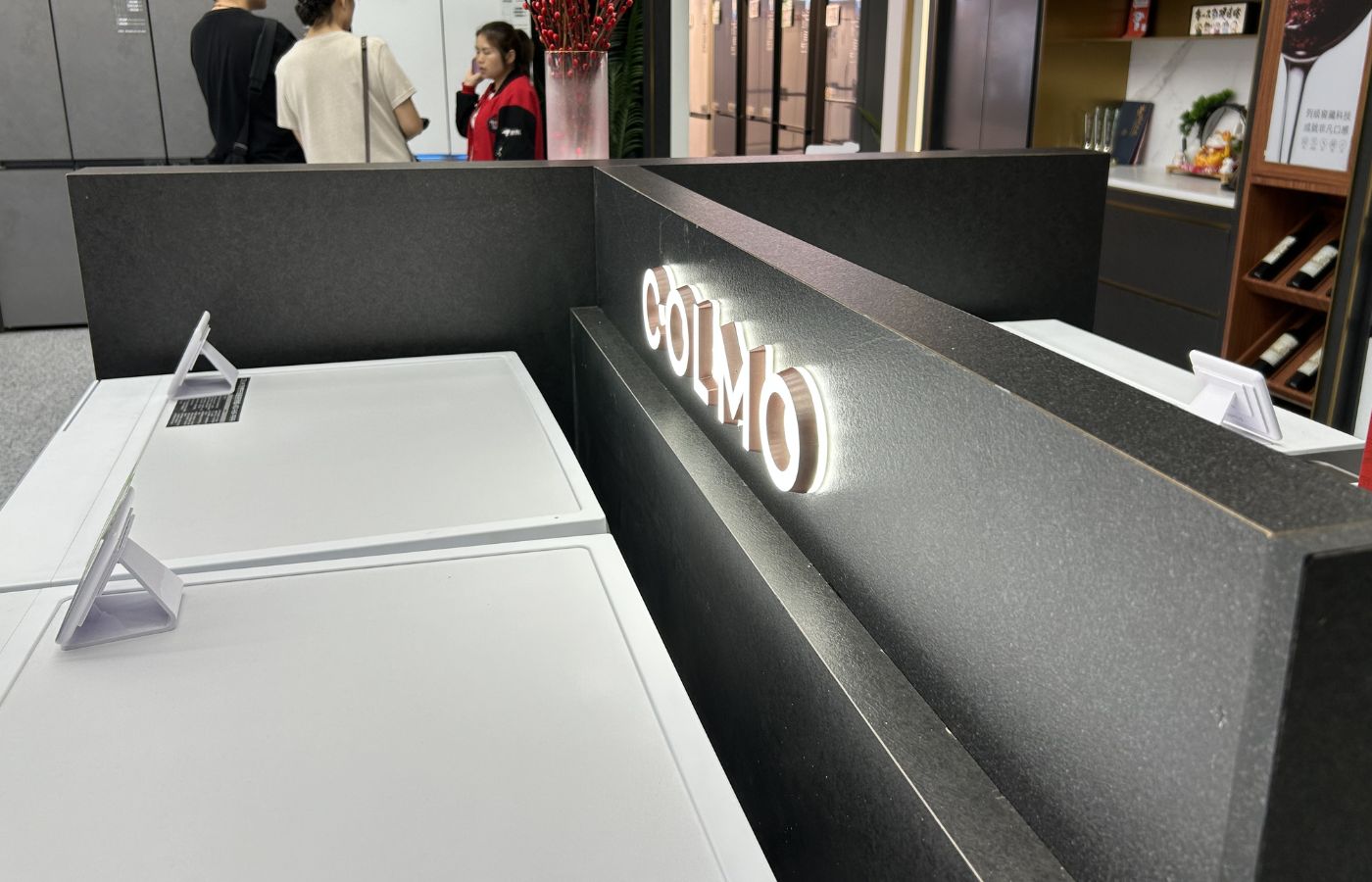 COLMO illuminated signage detail in retail display system