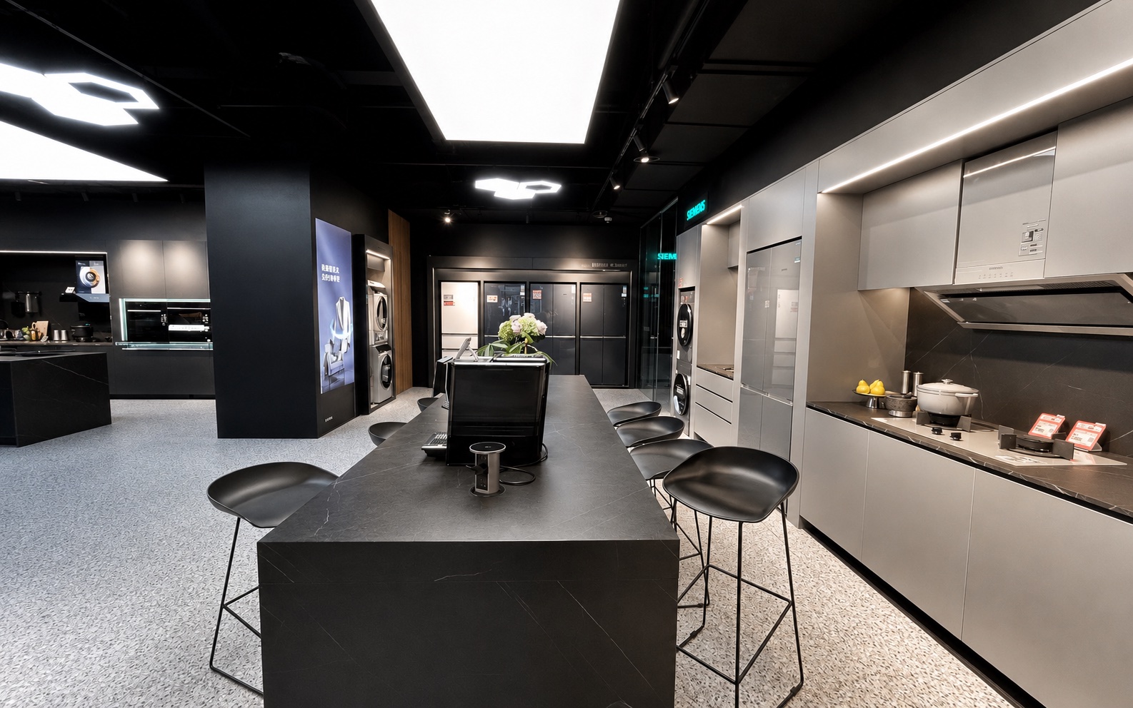 Siemens kitchen appliance experience zone with island counter and built-in appliances