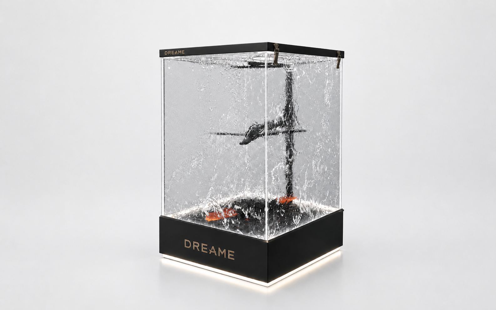 Angled studio view of DREAME water flow demonstration display showing acrylic enclosure, illuminated base and internal mechanism