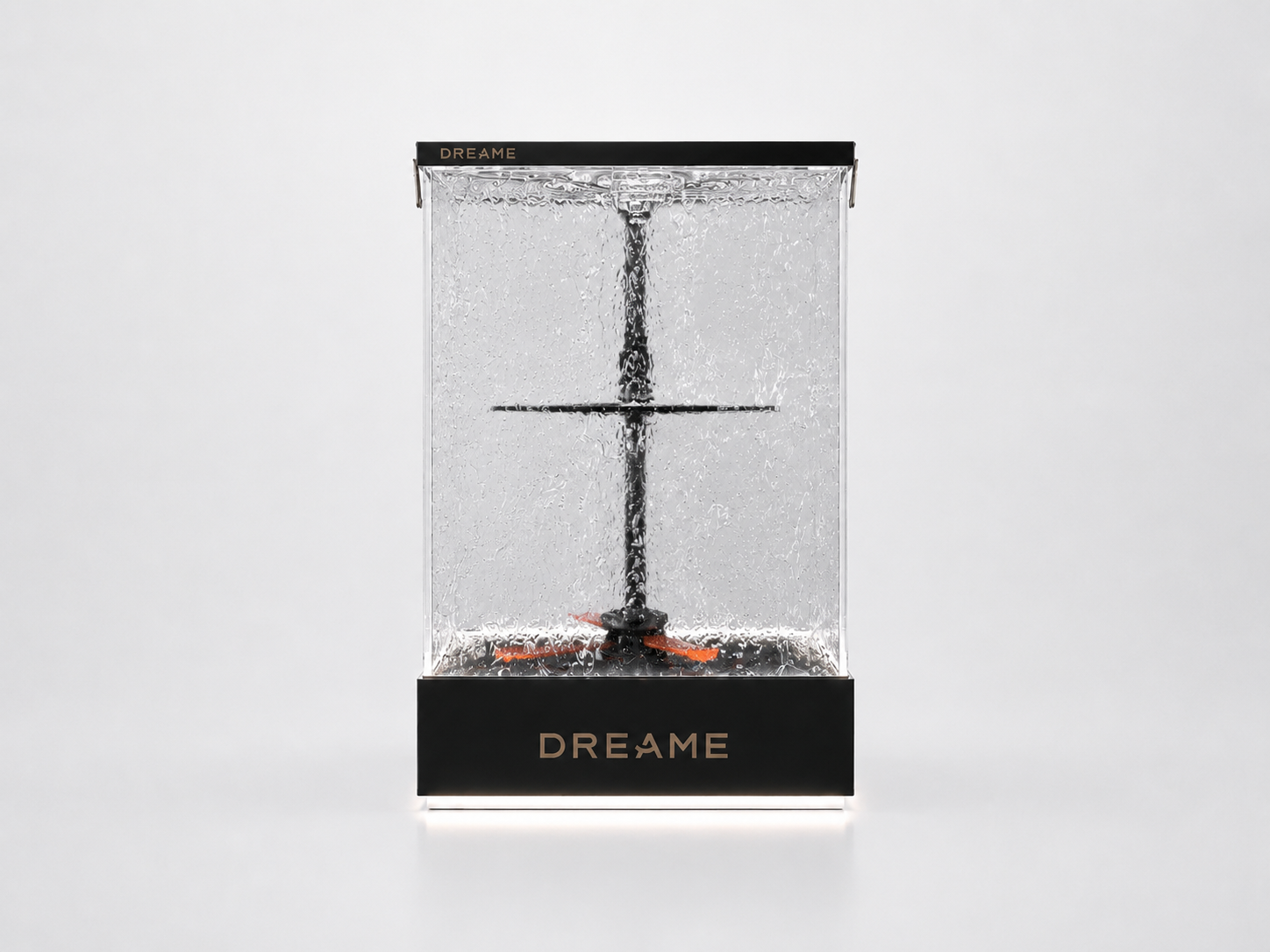Front view of DREAME water flow demonstration display showing full acrylic tank, internal vertical mechanism and illuminated brand base