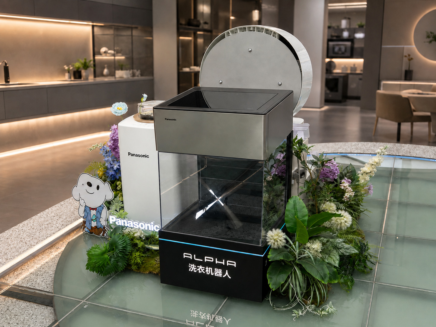 Complete Panasonic ALPHA interactive laundry robot demo display with visible mechanism, companion appliance, illuminated branding, planting and glass platform