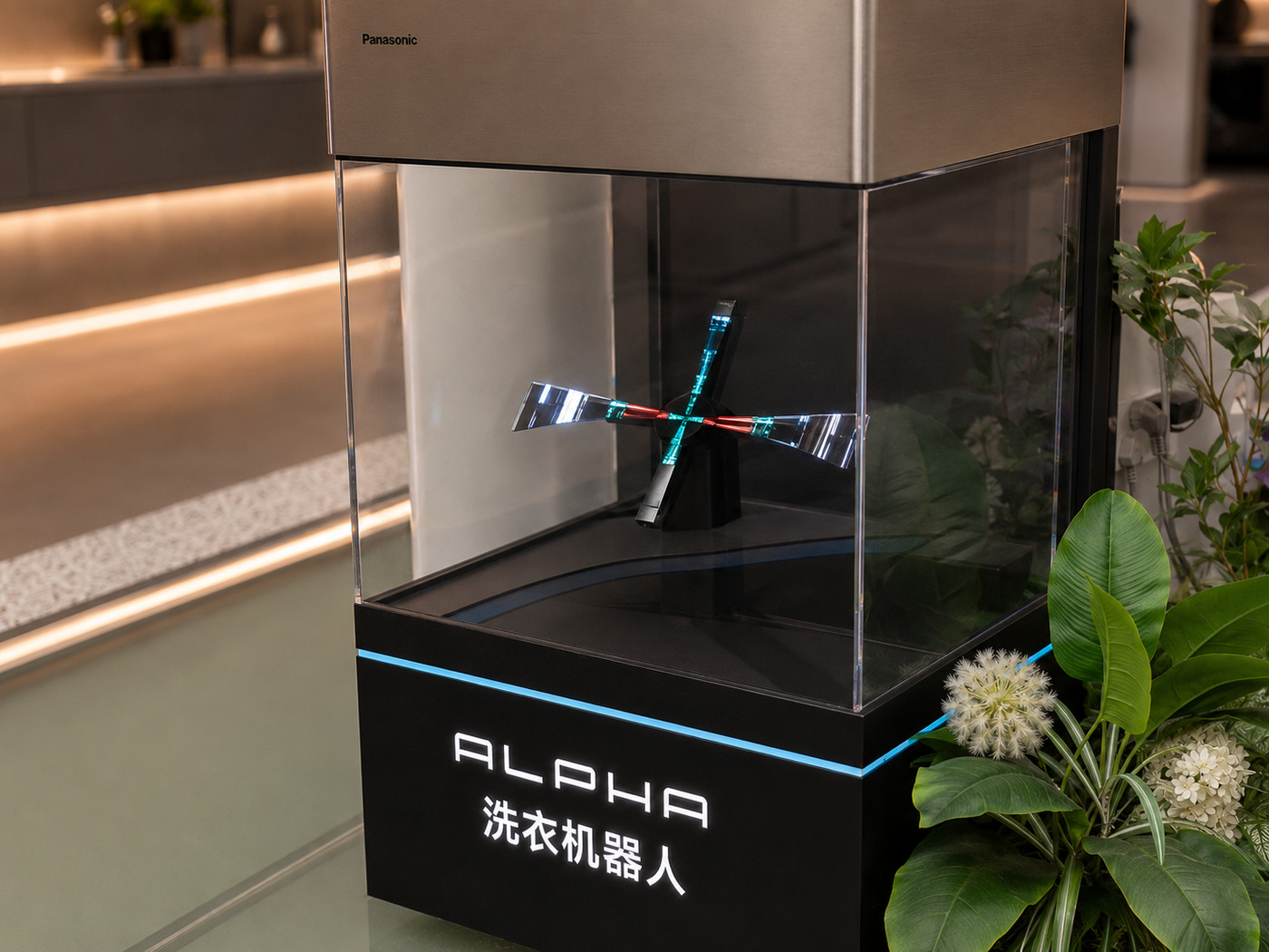 Transparent Panasonic ALPHA demo chamber with illuminated cross-shaped internal mechanism, acrylic edges and branded base